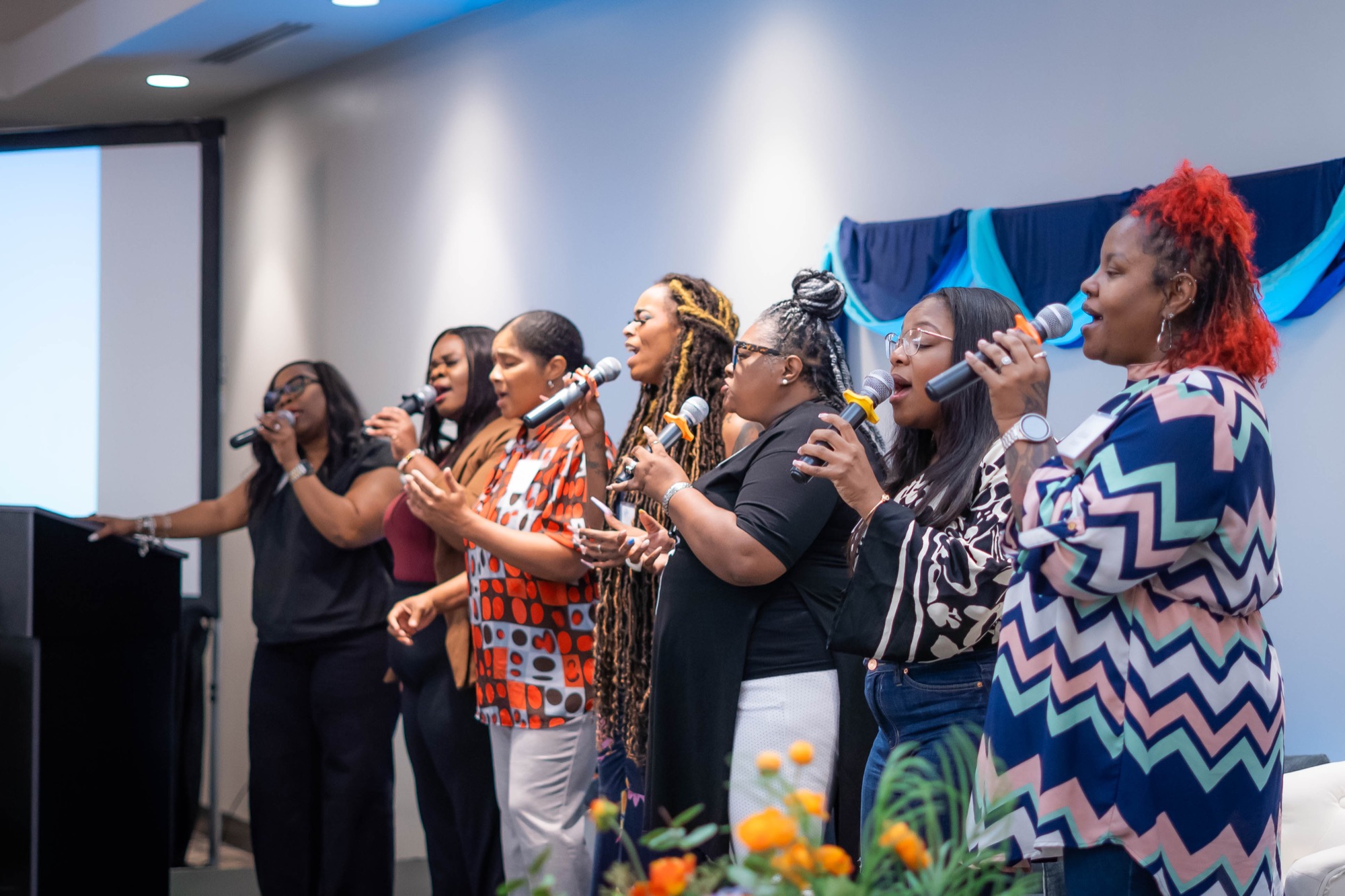 Worship team singing at a past Be1 Experience